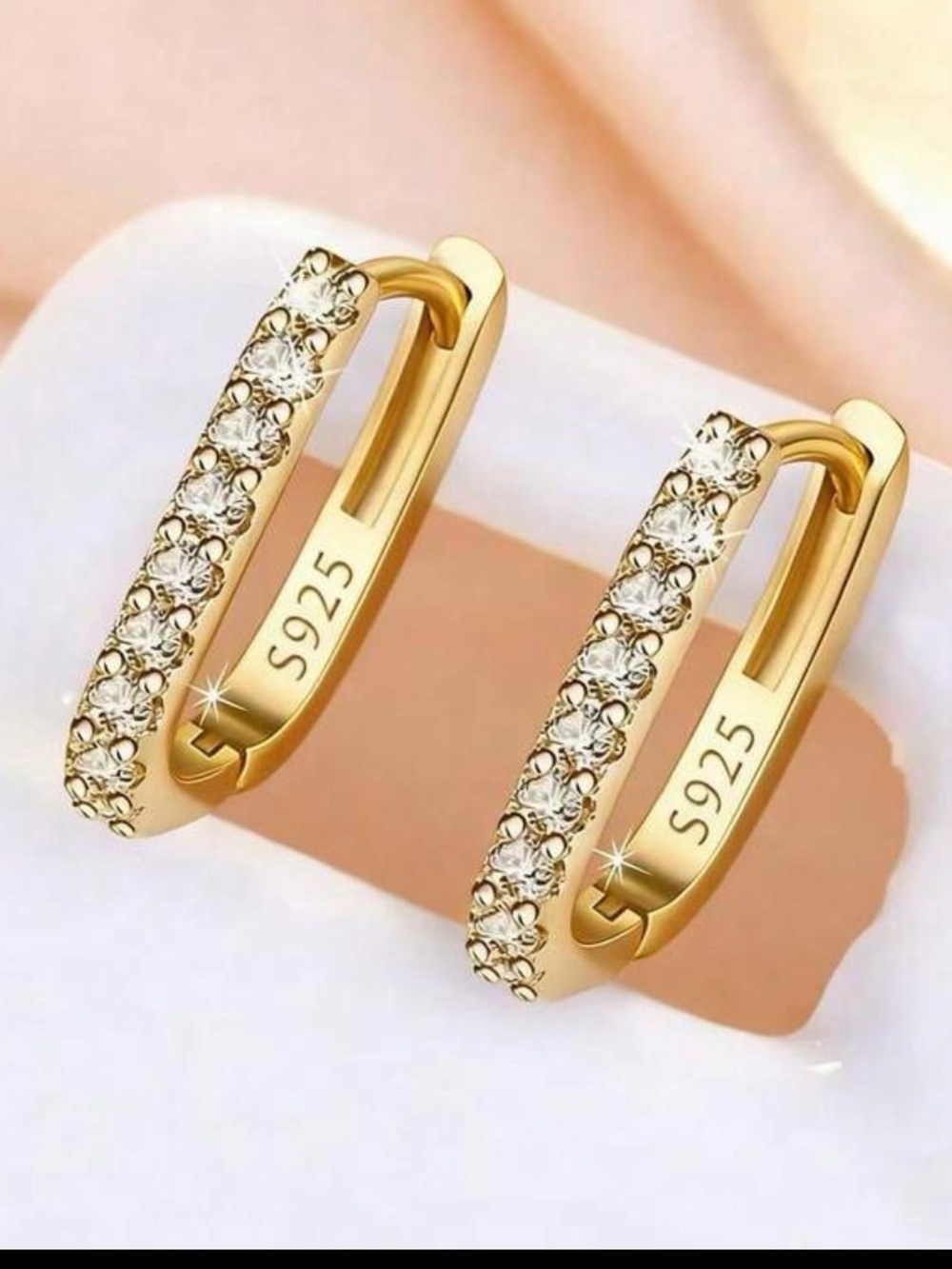 18K gold oval hoop earrings with sim diamonds simple classy minimalistic